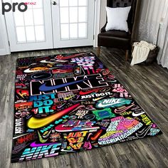 the rug is covered with various stickers and decals, all on top of a wooden floor