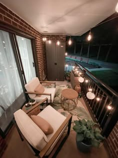 a living room filled with furniture next to a window covered in lights and greenery