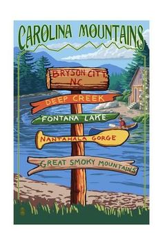 a wooden sign post with many signs on it in front of a lake and mountains