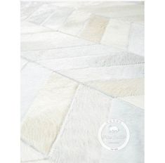 an image of a white and beige rug with squares on the bottom, one in the middle