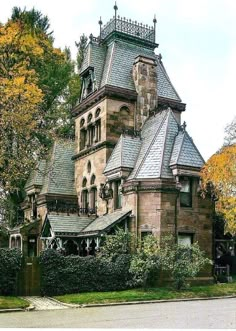 an old house with a tower and many windows