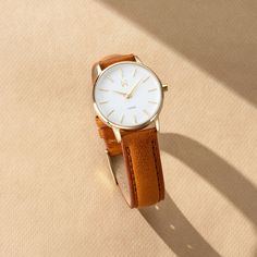 the avenue collection’s pretty and petite design is inspired by the classic style of new york. timeless women’s timekeeping meets an italian tan pebbled leather strap, gold case, and white dial. Leather Watch For Women, Vintage Watches Women Leather, Brown Watches Women, Brown Watches, Vintage Watches Women, Watches Women Leather, Watches Women, Women Watches, Gold Case