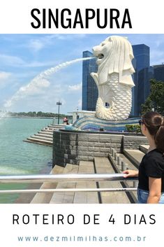 there is a woman looking at the water fountain