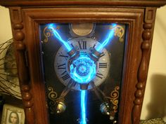 an old clock with blue lights on it