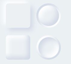 three white plates with rounded shapes on a light blue background in the shape of squares and rectangles