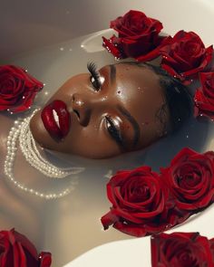 a woman with red lipstick and pearls in a bath filled with water surrounded by roses