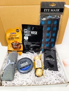 an open box containing various items including coffee, face masks and eye mask in it