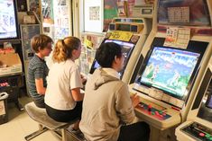 children playing video games in an arcade