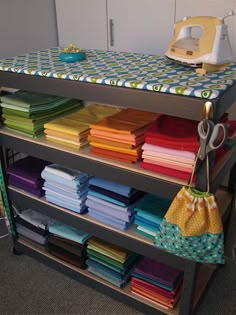 an ironing board with many different fabrics on it