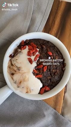 a brownie batter and baked oats in a bowl