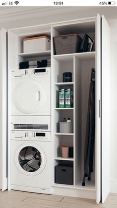 a white washer and dryer sitting inside of a closet