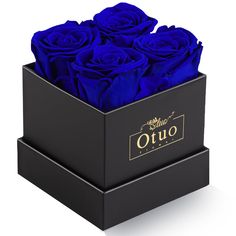 a black box with blue roses in it that says otuo on the front and side