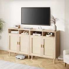 a flat screen tv sitting on top of a wooden cabinet