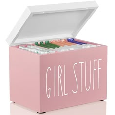 a pink box with the words girlstuff in white lettering on it and several different colored pencils inside