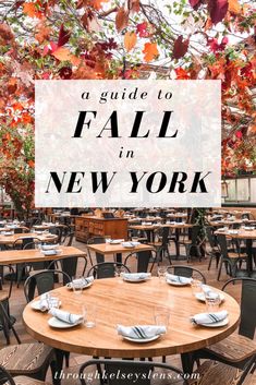 an outdoor dining area with tables and chairs under a canopy that reads, a guide to fall in new york