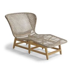 an outdoor lounge chair with a wooden frame and woven seat pad on the backrest