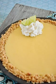 a pie with a lime slice on top of it