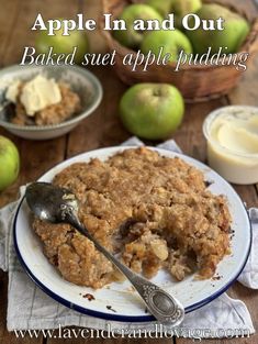 an apple pie is on a plate with a spoon and some apples in the background