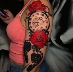 a woman with a clock and roses tattoo on her arm