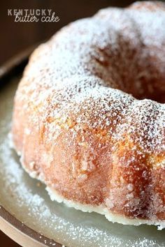 a powdered sugar covered bundt cake on a plate