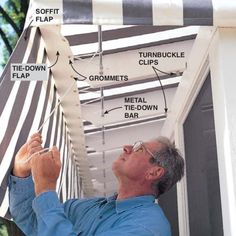 a man working on the side of a tent with instructions for how to install it