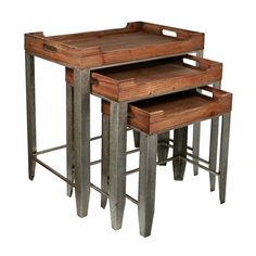 three metal and wood nesting tables with one sitting on the other, each topped with a wooden tray