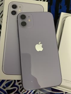 two new iphones are sitting next to each other