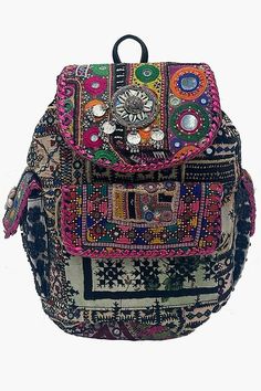 The Banjara Backpack is a handmade marvel, adorned with traditional Banjara embroidery featuring mirrors, shells, and leather. With 2 side pockets, a front pocket, and ample storage space inside, this backpack is as functional as it is beautiful. Perfect for adding a touch of culture to your daily adventures. Disclaimer: These are 100% handmade bags. No 2 bags are the same. Guaranteed that you will receive the same bag but please be aware that the design and colors may vary. Bohemian Backpack For Festivals, Multicolor Rectangular Backpack For Festivals, Bohemian Multicolor Backpack For Festival, Bohemian Rectangular Backpack For Festivals, Bohemian Handmade Backpack For Travel, Bohemian Multicolor Travel Backpack, Bohemian Handmade Travel Backpack, Multicolor Rectangular Festival Backpack, Festival Rectangular Multicolor Backpack