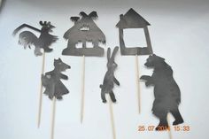 the cake toppers are made to look like they have animals and houses on them