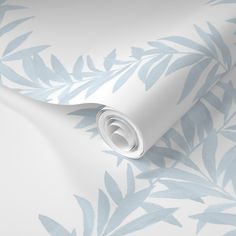 a blue and white wallpaper with leaves on the side, it's very soft