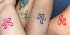 three people with matching tattoos on their arms