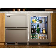 an open refrigerator with drinks and beverages in it's door, on a wooden floor