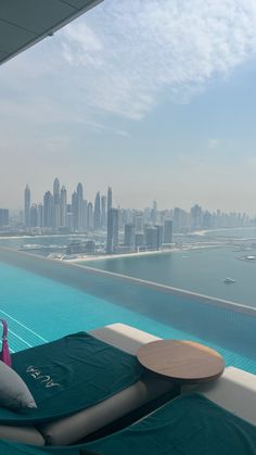 a pool with a view of the city skyline