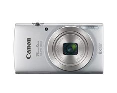 a silver digital camera sitting on top of a white surface