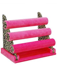 a pink shelf with leopard print on it