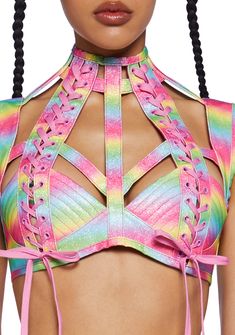 will have ya feelin’ the celestial magic. Embrace the starlight hour in this cut-out lace-up bra top that has an ombre rainbow vegan leather construction, a glitter finish, boning in the bodice, a high neckline and a back zip closure. Burner Outfits, Gogo Fashion, Rave Bae, Rave Party Outfit, Rave Festival Outfits, Celestial Magic, Rainbow Top, Glitter Rainbow, Rainbow Ombre