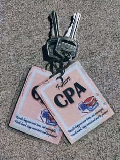 two keys are attached to the back of a pink license plate that says, future cpua