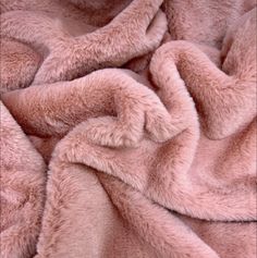 a pink blanket is laying on the floor