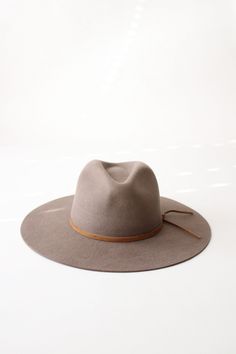 Add a dash of vintage charm to your wardrobe with The Beverly Rancher Hat. Made of high-quality wool felt in a warm khaki color, this hat is perfect for keeping your head stylishly warm during chilly days. Embrace the rancher lifestyle with this playful and quirky accessory. Yee-haw! Approx.3.8" Teardrop Crown3.5" Flat Brim Made of:100% Wool Felt Made In EcuadorFirm/Stiff BodySuede Hat BandCotton SweatbandWater RepellentSatin Lined Suede Hat, Rancher Hat, Yee Haw, Felt Hat, Khaki Color, Wool Hat, Custom Hats, Your Head, Vintage Charms