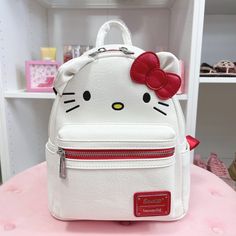 Hello Kitty Loungefly Mini Backpack Nwt Rare Hello Kitty Loungefly Backpack Adorable Faux Leather Mini Backpack By Loungefly Featuring Hello Kitty. Design Has Embroidered Detailing, Red & Silver-Tone Accents, Adjustable Shoulder Straps, Zippered Main Compartment, Zippered Front Compartment, And A Lined Red Interior With Hello Kitty's Bow Patterned Throughout. 1 Zippered Main Compartment 1 Zippered Front Compartment Adjustable Shoulder Straps 8 1/2" H X 7" W (Purse Size) Imported Smoke Free Home Hello Kitty Things To Buy, School Hello Kitty, Hello Kitty Merch, Rare Hello Kitty, Disney Princess Books, Harry Potter Backpack, Mermaid Backpack, Sanrio Bag, Loungefly Mini Backpack