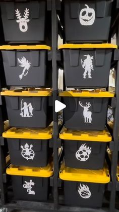 black and yellow storage bins with halloween stencils on them