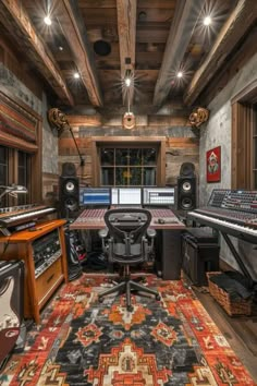 an old recording studio with lots of sound equipment and lights on the ceiling, in front of a large rug