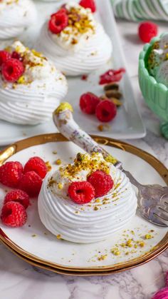 small desserts with raspberries and whipped cream are on the table, ready to be eaten