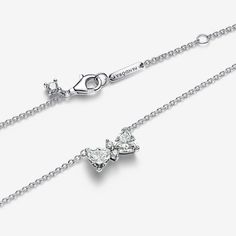 You're never fully dressed without a bow. But this time, that bow is made up of sparkling cubic zirconia, set in a sterling silver bow-shaped centrepiece, fixed to an adjustable chain. The stones have been especially cut to create a bow shape when arranged, ready to tie all your looks together. Wear this collier necklace for a touch of festive sparkle, or wrap it with love for the one who's top of your gift list. - Pandora Sparkling Bow Necklace - Sterling silver / Cubic Zirconia / Clear - Sz. 4 Charms Disney, Tlc Outfits, Hello Kitty Decorations, Pandora Bracelet Charms Ideas, Coquette Jewelry, Christmas Wants, Pandora Essence, Dream Items, Pandora Necklace