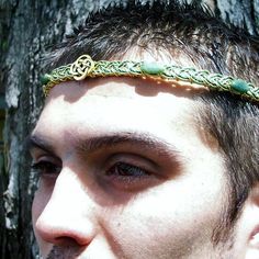 "A Celtic knot symbol is flanked by six oval green jade pieces in this unisex circlet, inspired by the dark green mossy glades of Ireland and Scotland. The central strand of the weave is a two color twist, a mix of grass/emerald green and dark moss, emphasizing the deep colour of the gemstones. The main/base color can be gold, silver or copper. Shape options: Straight is as shown in the pictures V-Front is with a dip in the Celtic weave band, Celtic charm at the point of the dip. A photo compari Crown For Men, Celtic Crown, Story Help, Celtic Knot Wedding, Ireland And Scotland, Color Twist, Celtic Weave, Elven Jewelry, Red Jewel