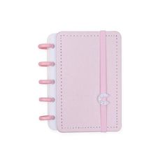 a pink and white notebook with clips on it