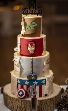 a three tiered cake with captain america decorations