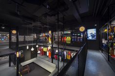 the inside of a store with lots of clothing on display