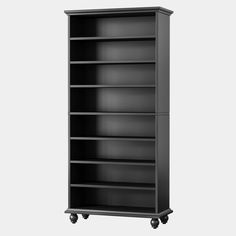 an empty black bookcase with wheels on the bottom and bottom shelves, against a white background