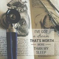 an open book with writing on it next to some scissors and a stethoscope